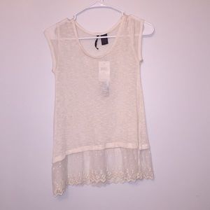Knit cream top with lace detailing at the bottom